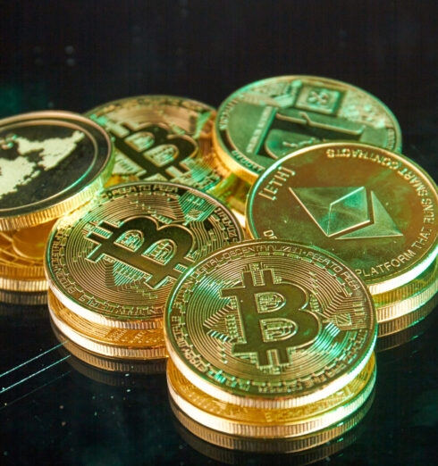 Bunch of golden bitcoins and ethereum coins close-up. Bunch of golden bitcoins and ethereum coins close-up. Virtual money investment concept.