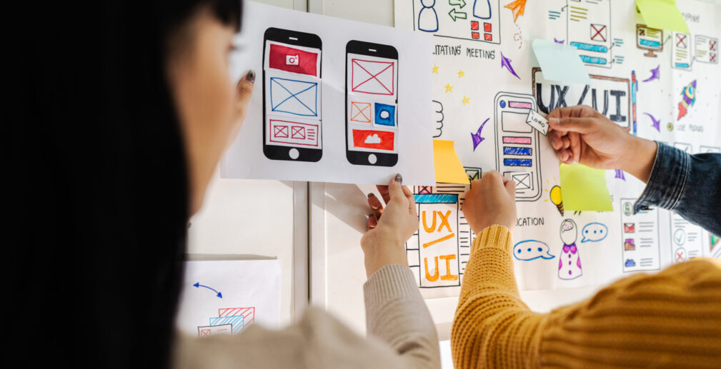 Close up ux developer and ui designer brainstorming interface wireframe design.Creative digital development agency Close up ux developer and ui designer brainstorming interface wireframe design.Creative digital development agency.