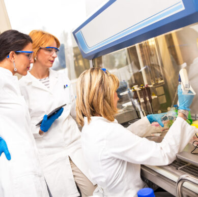 Photo of real female scientists researching in laboratory.