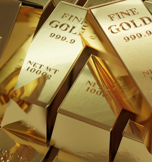 Pile of arranged gold bars of 1000g net weights A pile of arranged gold bars of 1000g net weights