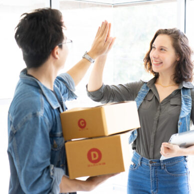 Worker In Warehouse Checking Boxes Using Digital Tablet.Start up small business entrepreneur SME or freelance man and woman working  at home concept, Young Asian small business owner,online marketing.